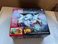 Front view of boxed Wilton 100 cookie cutters set