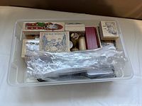 Stamps and accessories inside clear box
