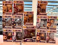 Front view of all 13 boxed figures