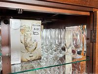 Retail box and multiple glasses on shelf