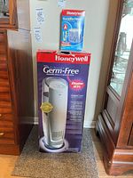 Boxed Honeywell Germ-Free Cool Mist humidifier with replacement filter box on top