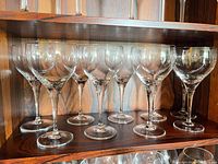 Shelf view showing all eight Rosenthal crystal white wine glasses