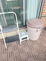 Trash can, step ladder, step stool shown together