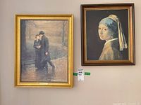 Both framed prints on wall showing frames and overall appearance
