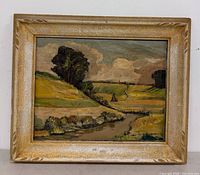 Front view of framed landscape painting