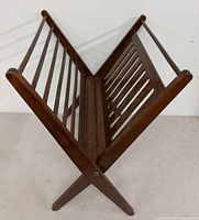 Magazine holder fully opened, angled view showing slatted construction