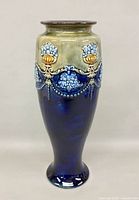 Full view of vase front showing coloration and relief decoration