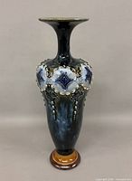Front view of entire vase showing form and decorative slip work