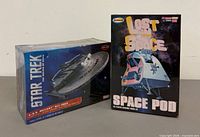 Front view of both sealed model kit boxes