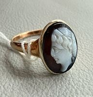 Side view of cameo ring showing profile carving and gold shank