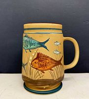 front view showing primary fish motif and handle