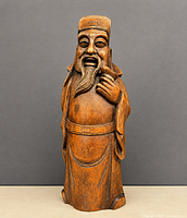 Full view of wooden Asian man statue front