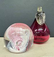 Caithness paperweight and cranberry glass pear front view