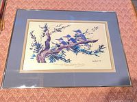 Framed lithograph showing full artwork, mat and frame