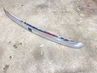 Full view of the 51" chrome trim piece on concrete floor