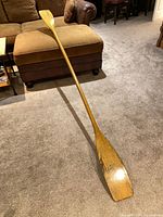 Full view of double-ended paddle on floor
