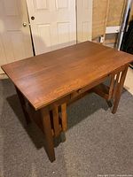overall top and front view of oak mission table