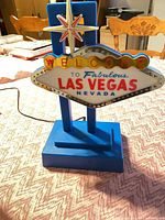 Front view of Las Vegas tabletop neon lamp on blue base