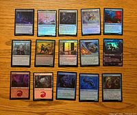 Front view of 15 assorted MTG cards laid out
