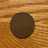Reverse side showing ONE CENT CANADA 1916 within maple leaf wreath