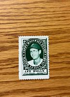 Front view of 1961 Topps Lee Walls stamp showing image and text