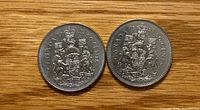 Both coins reverse side Canadian Coat of Arms visible