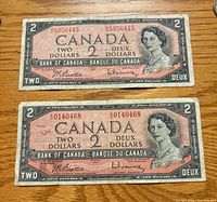Front view of both 1954 Canada $2 bills showing serial numbers, portrait, overall wear