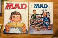 Front covers of both Mad magazines issues 156 and 149