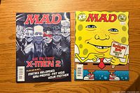 Front covers of both MAD magazine issues