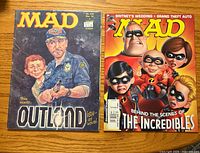 Front covers of both MAD magazines showing titles, cover art, issue number and price