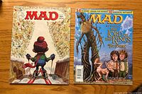 Front covers of both MAD magazines