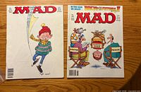 Front covers of both MAD magazines