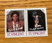 Front view of two joined stamps showing Michael Jackson images and 60c denomination