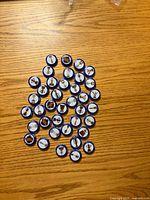 All 38 Labatt NHL promotional beer caps displayed on tabletop