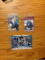 Front view showing all three sealed hockey cards