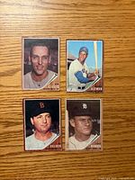 Fronts of four 1962 Topps baseball cards showing players Lillis, Altman, Delock, Boros