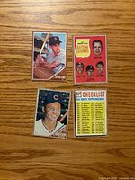 Front view of four sleeved 1962 Topps baseball cards