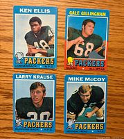 Fronts of all four 1971 Topps Green Bay Packers cards displayed on wood surface