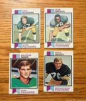 Front view of four 1973 Topps Green Bay Packers cards