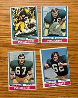 Fronts of four 1974 Topps Packers cards