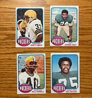 Front view of four 1976 Topps Packers cards