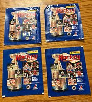 Front of four sealed 1992-93 Panini hockey sticker packs
