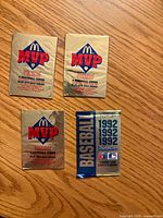 Front view of three gold McDonald’s MVP packs and one blue 1992 Donruss pack
