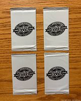 Front view of four sealed silver foil packs with Upper Deck 20th Anniversary 1988-2008 Hockey Preview logo