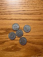 Reverse sides showing beaver design on five 1939 5-cent coins