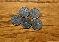 Reverse view of all five 1951 Canadian nickels showing commemorative design