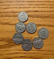 Seven 1949 Canada 5-cent coins reverse side with beaver design