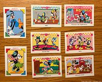 Fronts of eight Disney Minnie ’n Me trading cards laid out on table