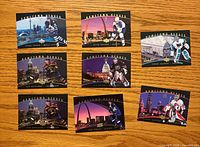Fronts of all eight Hometown Heroes cards showing city skyline designs and players