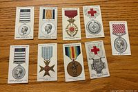 Front view of nine Player’s Cigarettes War Decorations & Medals cards